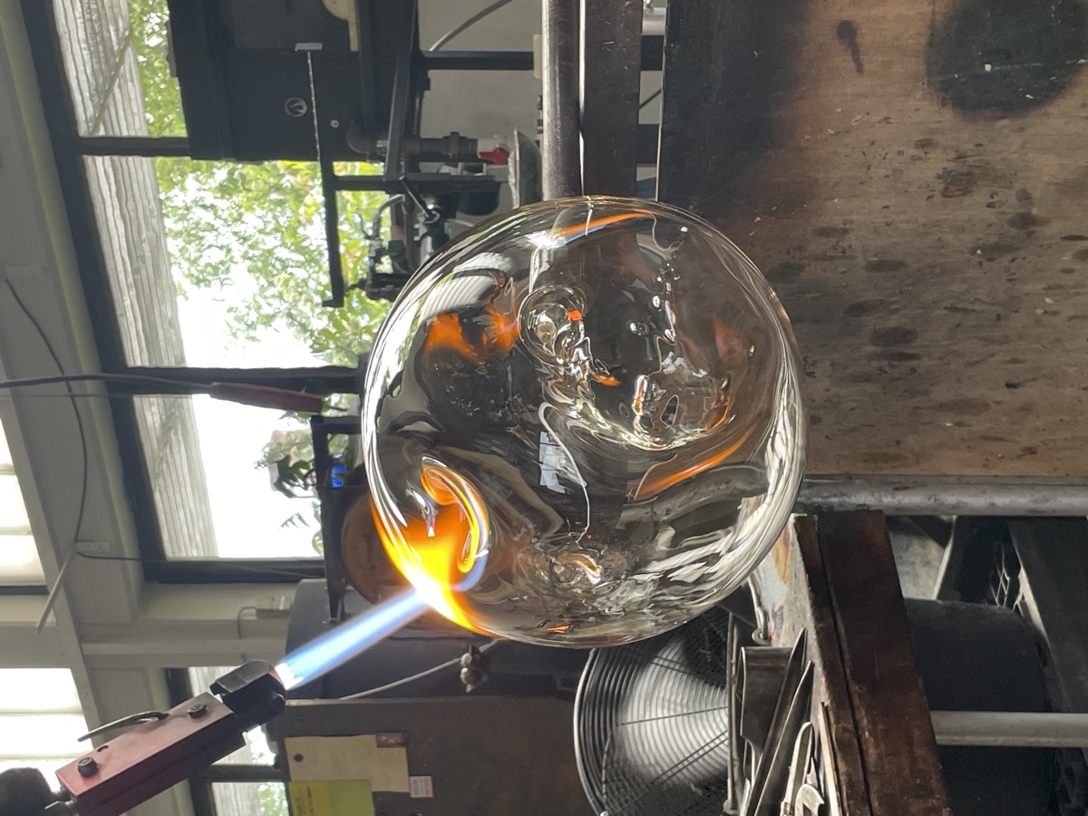 Glass blowing — sphere with flame